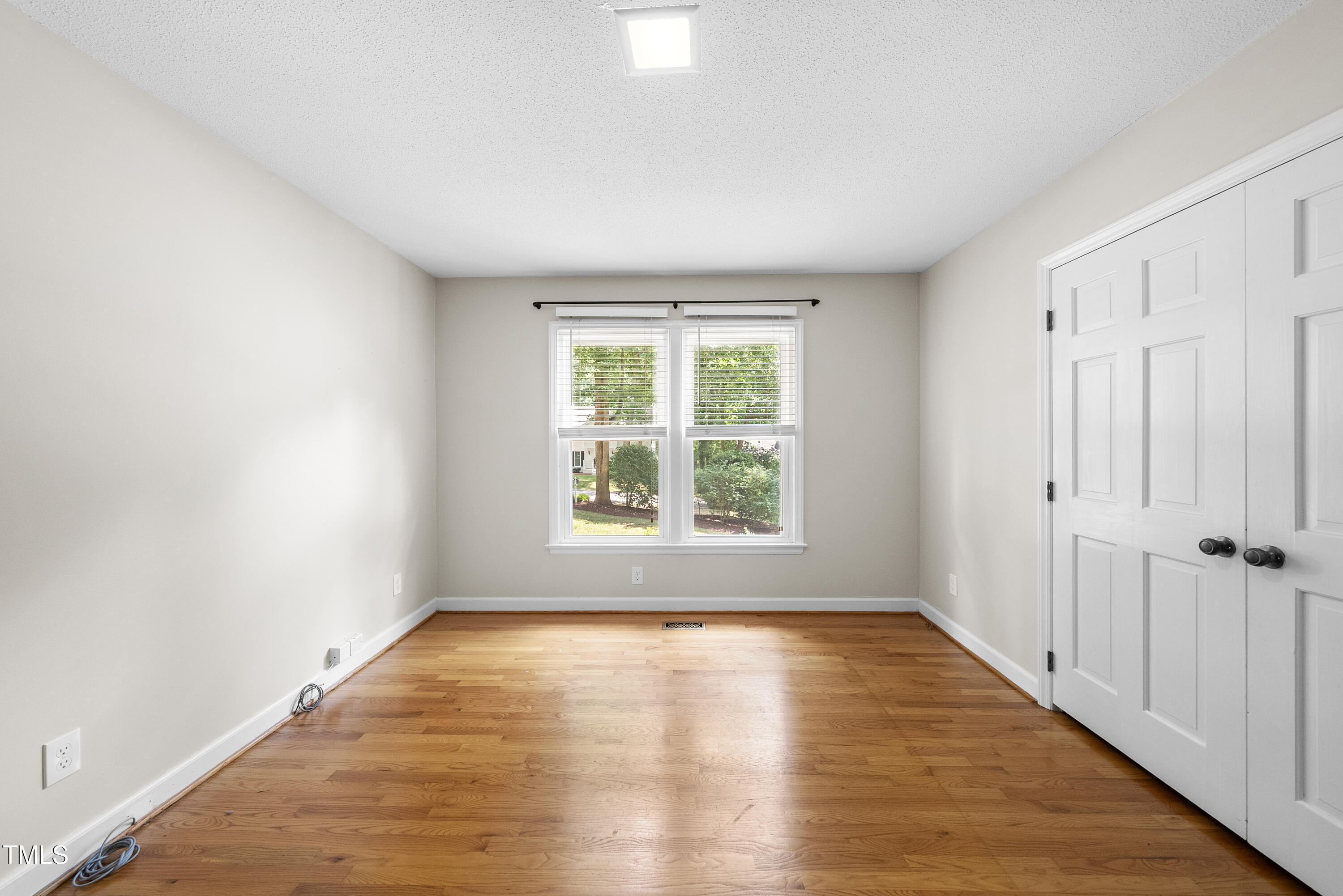 8629 Windjammer Drive Raleigh, NC 27615 - Photo 29 of 56 First Floor Bedroom with Hardwoods with Full Bath