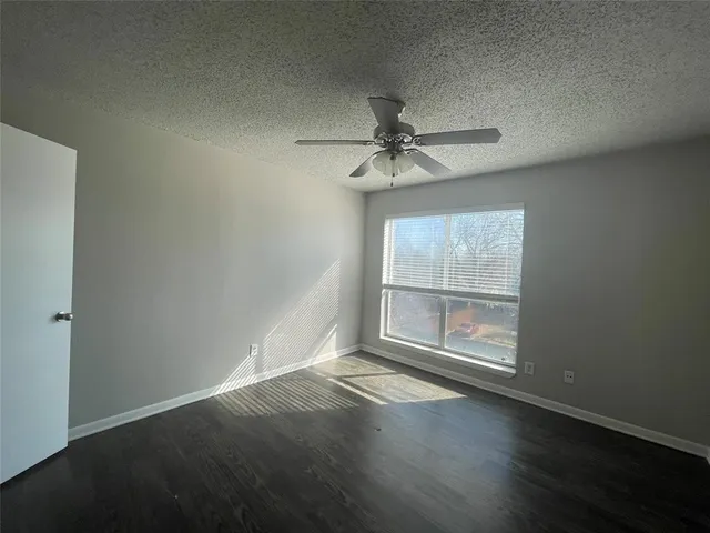 an outdoor space with swimming pool and furniture