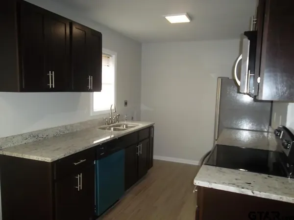 a view of a kitchen with a sink