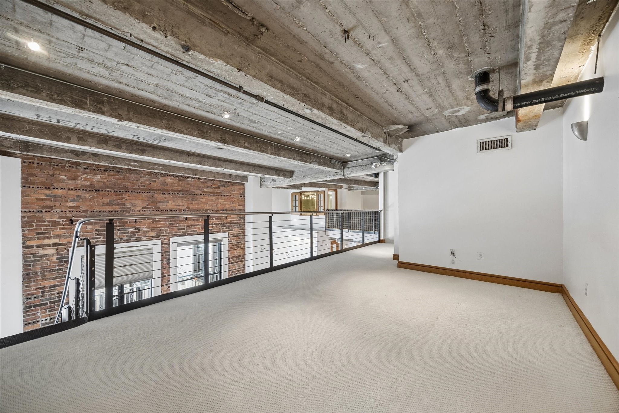 915 Franklin Street, Unit 9L Houston, TX 77002 - Photo 22 of 50 Media/game room—additional view with open overlook to first floor.