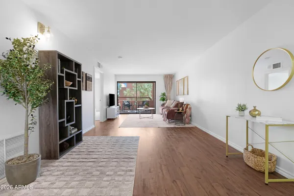 a living room with furniture and a table