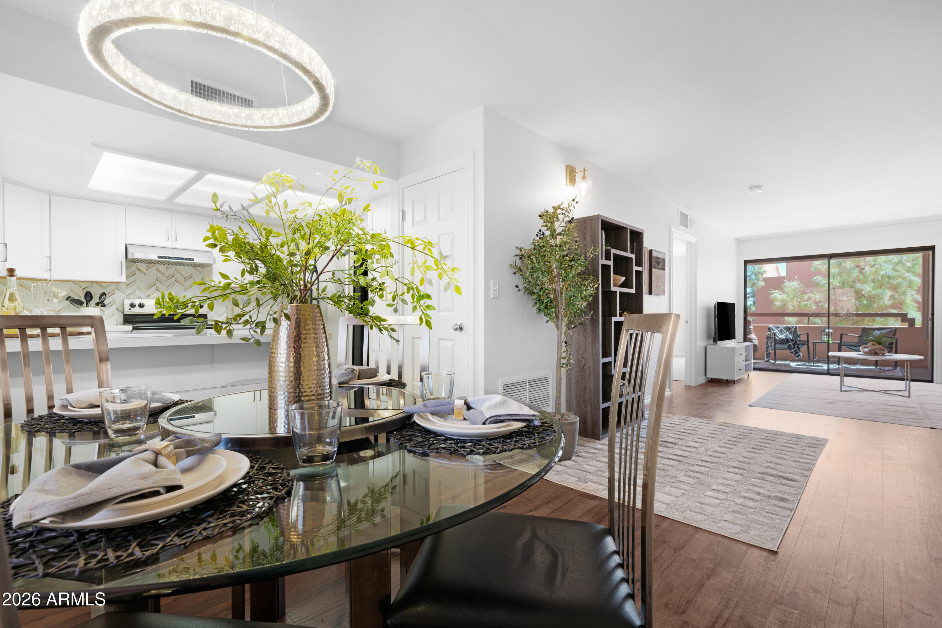 4303 East Cactus Road, Unit 410 Phoenix, AZ 85032 - Photo 19 of 50 a living room with furniture and a table
