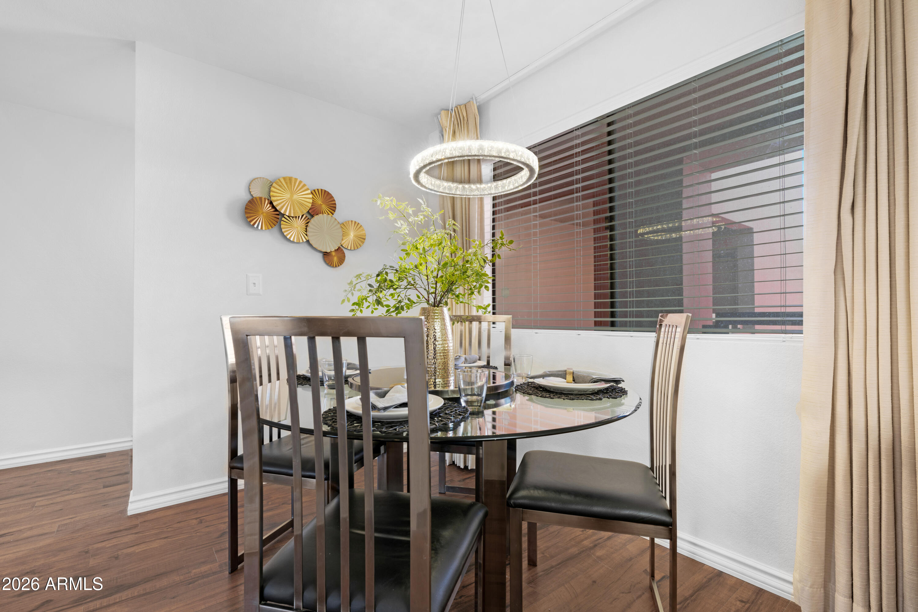 4303 East Cactus Road, Unit 410 Phoenix, AZ 85032 - Photo 20 of 50 a dining room with furniture and window