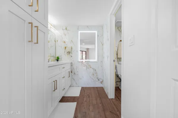 a bathroom with a double vanity sink and a mirror