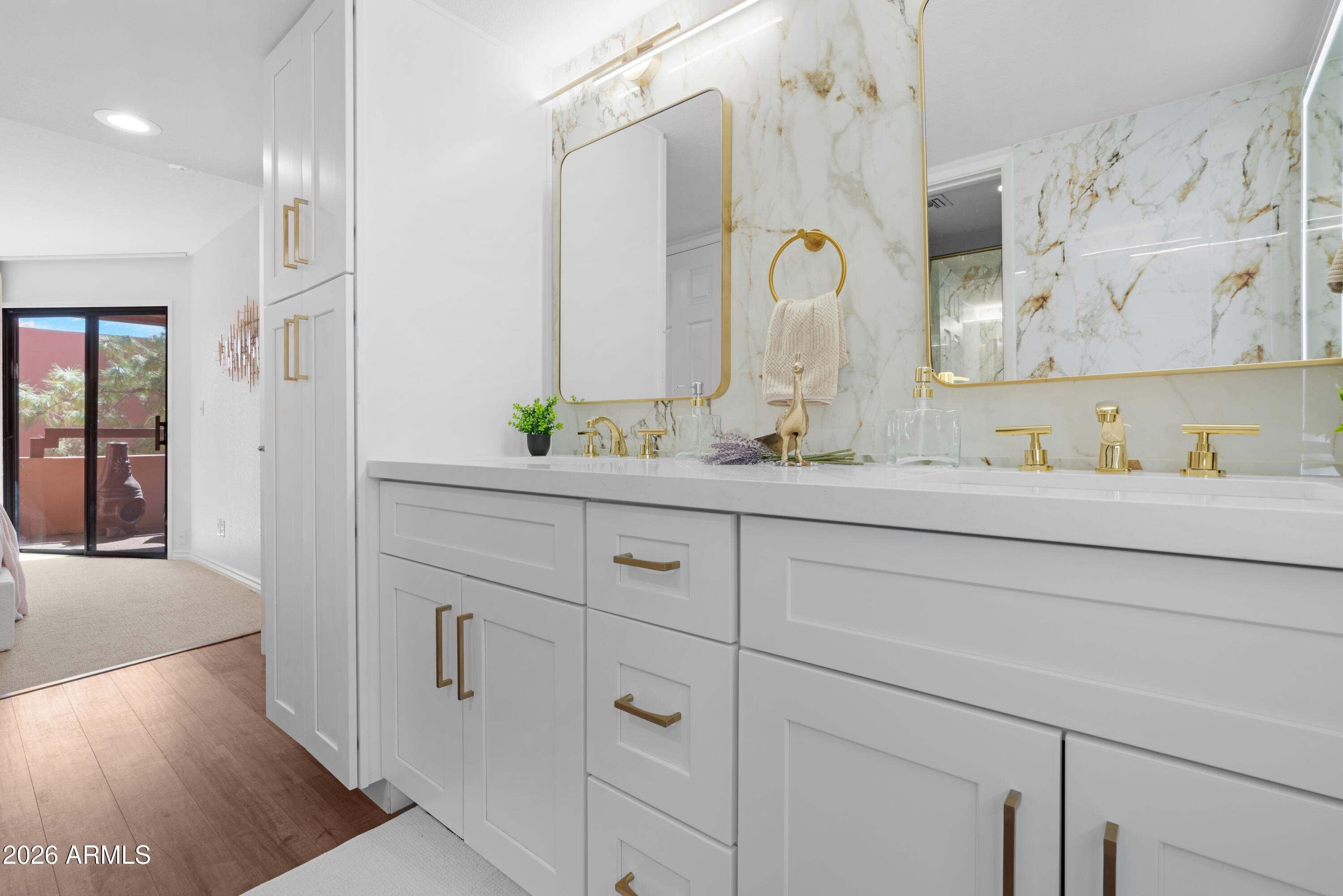 4303 East Cactus Road, Unit 410 Phoenix, AZ 85032 - Photo 25 of 50 a bathroom with a double vanity sink and a mirror