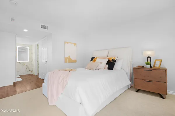 a bedroom with a bed and window