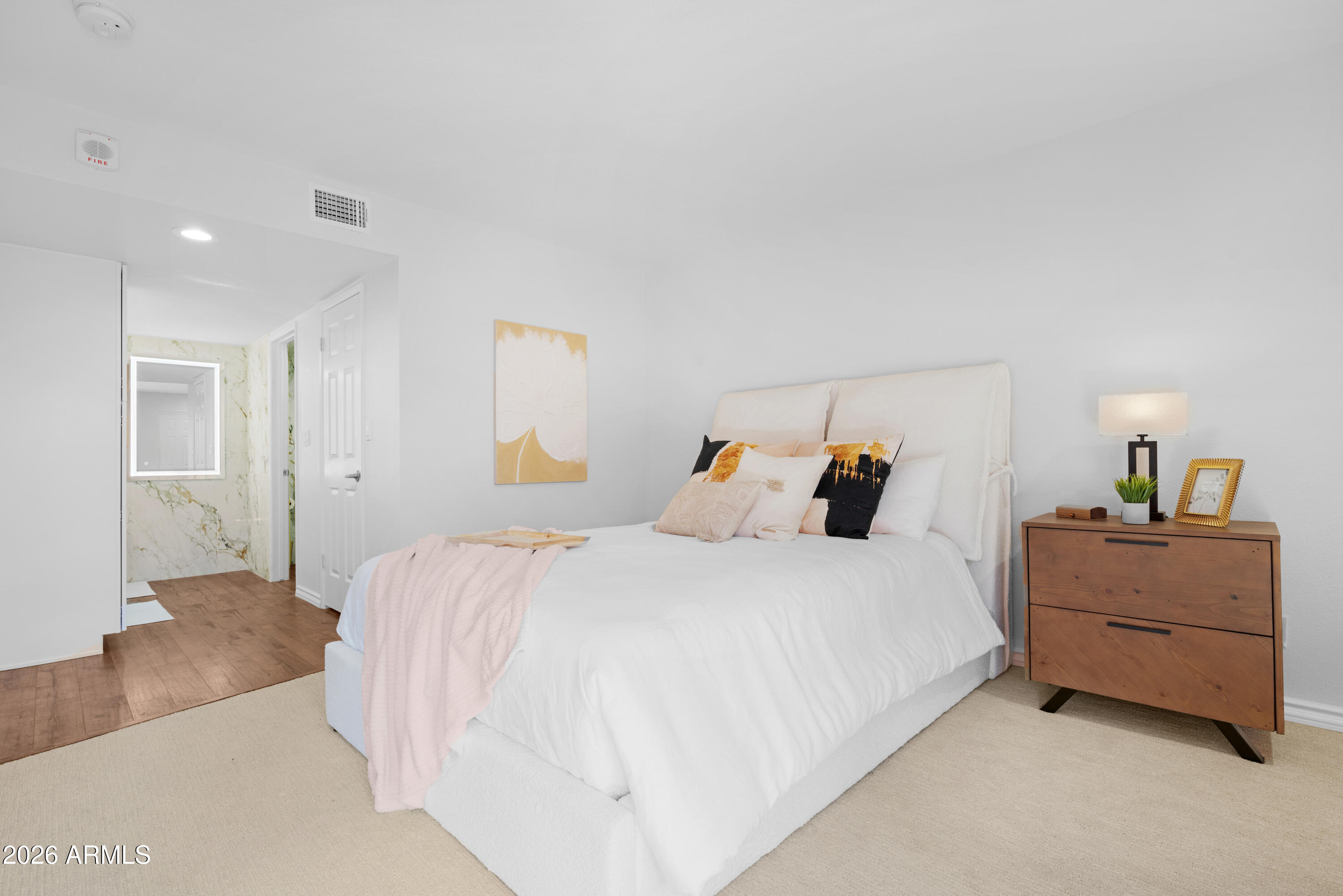 4303 East Cactus Road, Unit 410 Phoenix, AZ 85032 - Photo 27 of 50 a bedroom with a bed and window