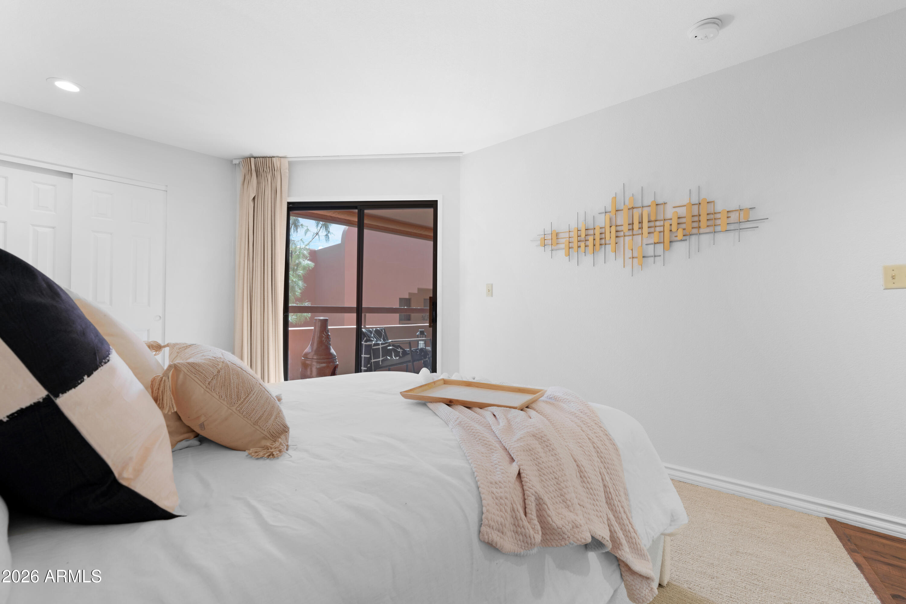 4303 East Cactus Road, Unit 410 Phoenix, AZ 85032 - Photo 29 of 50 a bedroom with a bed and window