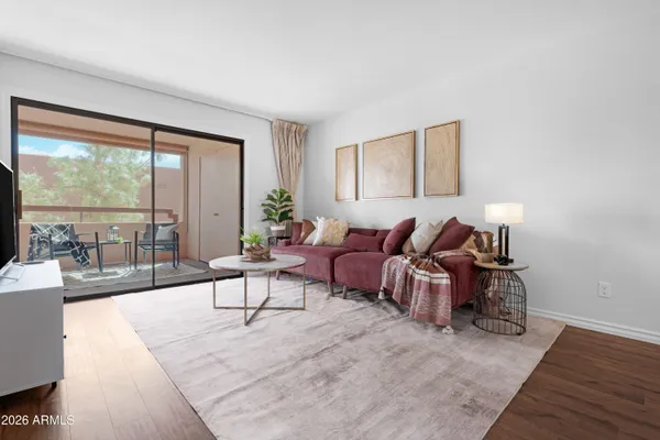 a living room with furniture and a large window