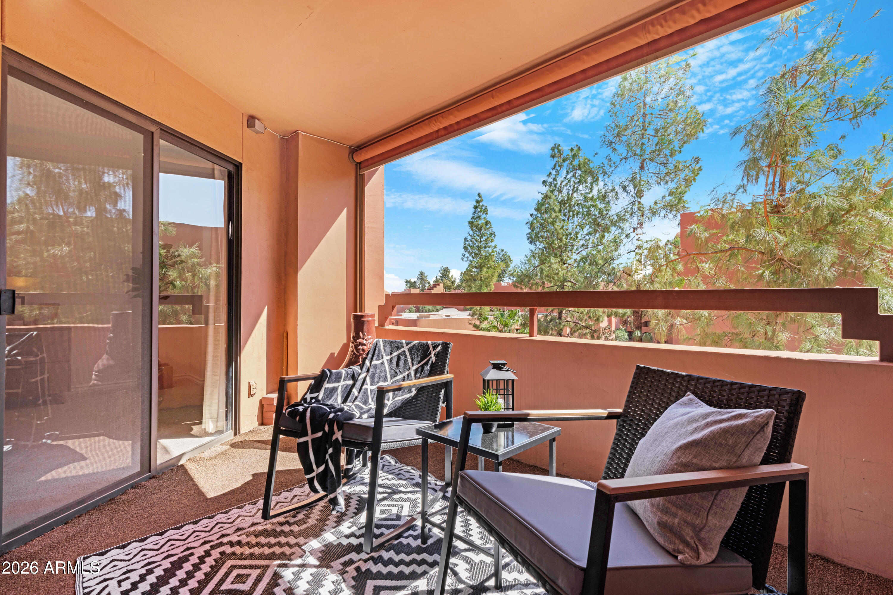 4303 East Cactus Road, Unit 410 Phoenix, AZ 85032 - Photo 31 of 50 a outdoor room with chairs