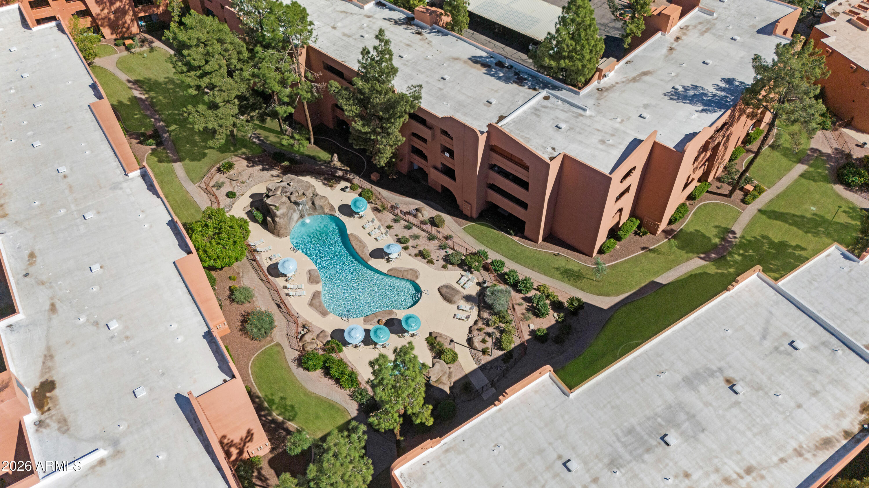 4303 East Cactus Road, Unit 410 Phoenix, AZ 85032 - Photo 38 of 50 an aerial view of a house with a garden