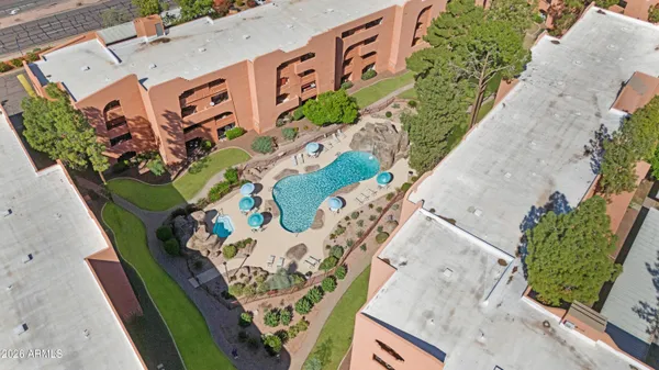 an aerial view of a house with a swimming pool