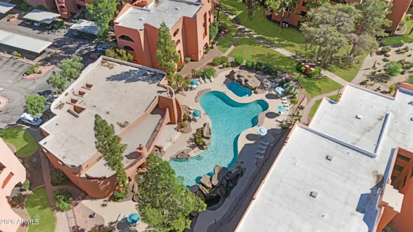 an aerial view of residential houses with outdoor space