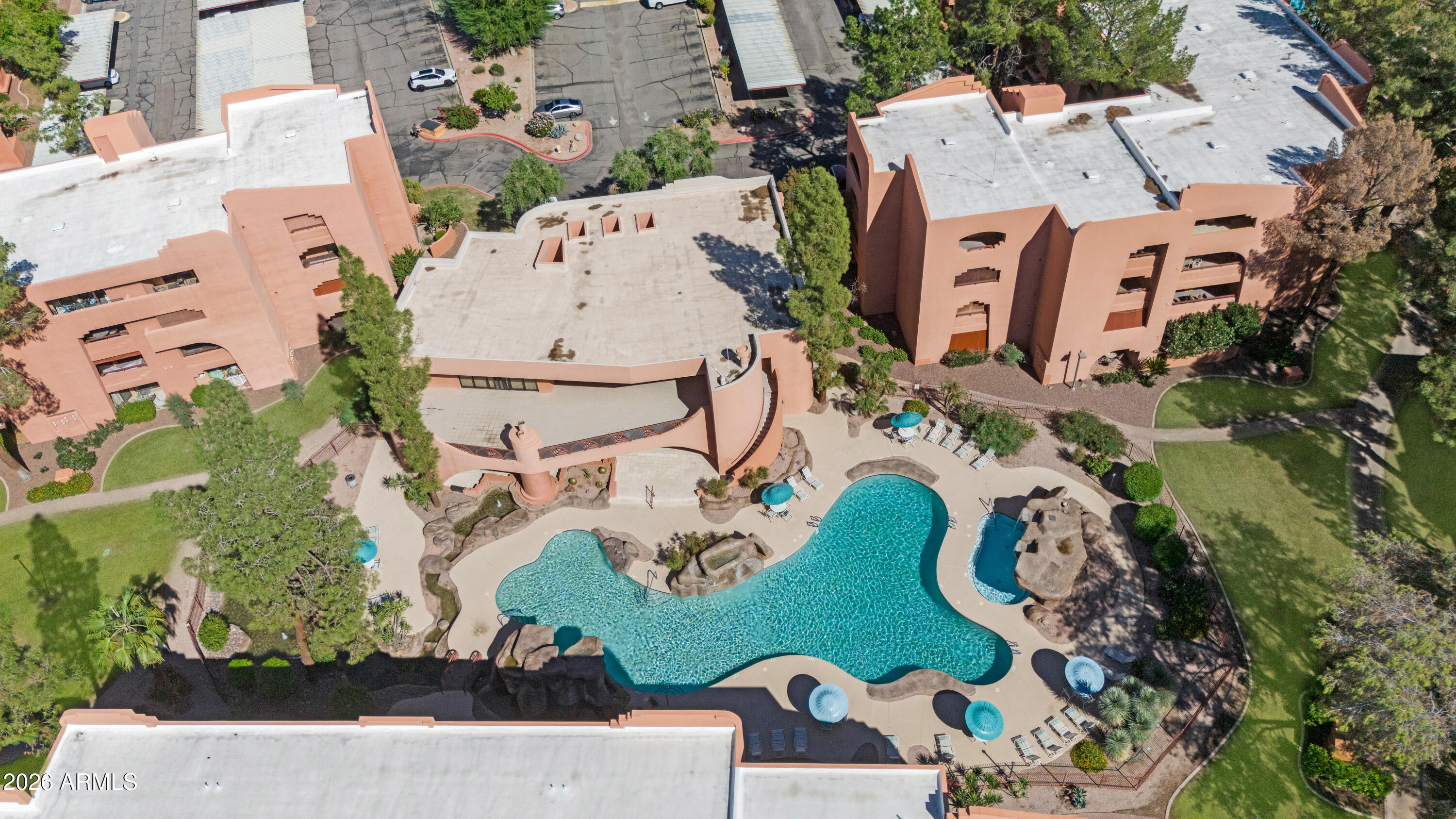 4303 East Cactus Road, Unit 410 Phoenix, AZ 85032 - Photo 45 of 50 an aerial view of a house with a swimming pool