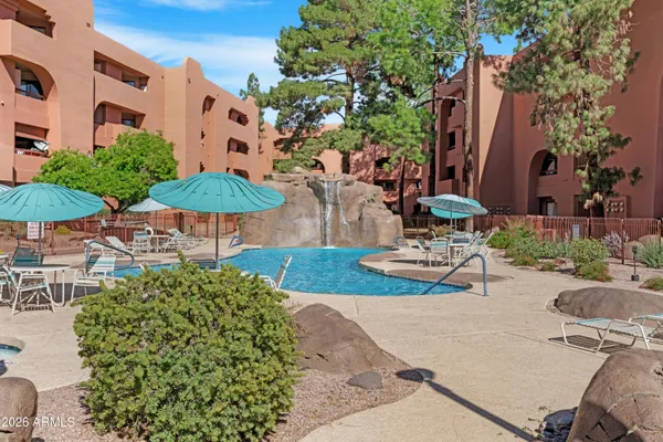 a view of backyard with outdoor seating