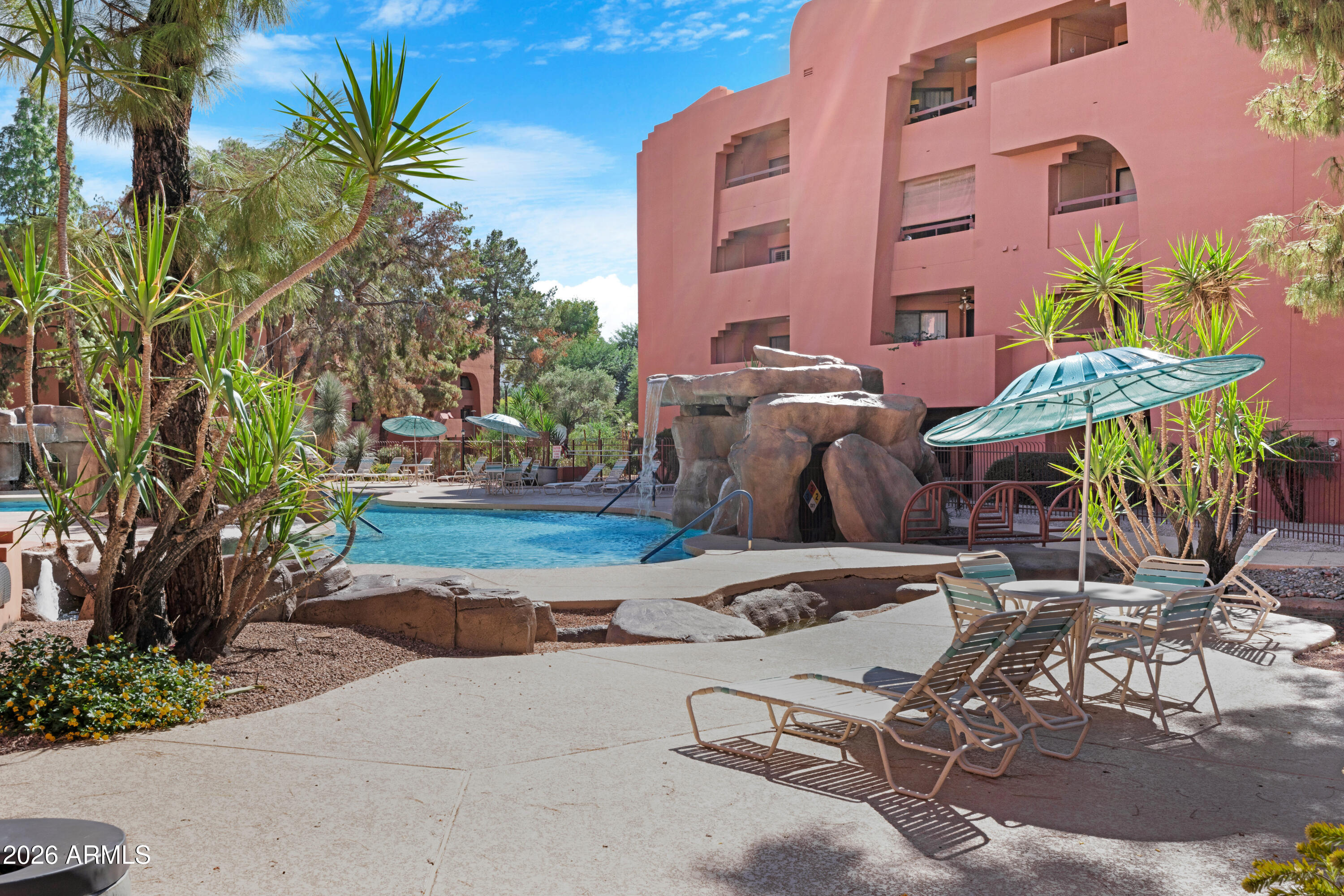 4303 East Cactus Road, Unit 410 Phoenix, AZ 85032 - Photo 49 of 50 a view of backyard with outdoor seating