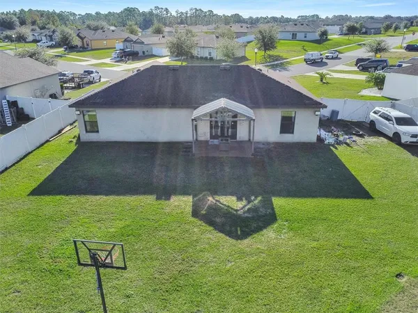 an aerial view of a house with a garden