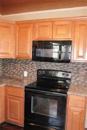 43 Appleton Street Springfield, MA 01108 - Photo 14 of 29 a kitchen with granite countertop white cabinets appliances and a window