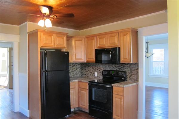 43 Appleton Street Springfield, MA 01108 - Photo 3 of 29 a kitchen with stainless steel appliances granite countertop a refrigerator a stove a sink and a microwave