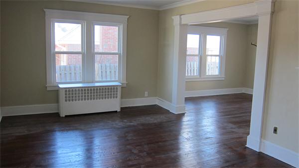 43 Appleton Street Springfield, MA 01108 - Photo 6 of 29 a view of an empty room with wooden floor and a window