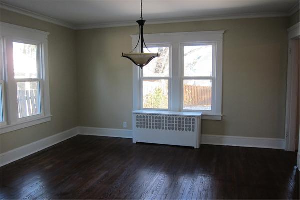 43 Appleton Street Springfield, MA 01108 - Photo 8 of 29 a view of an empty room with wooden floor and a window