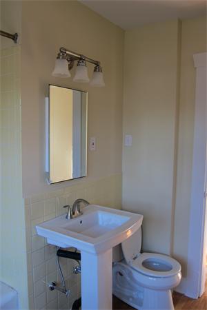 43 Appleton Street Springfield, MA 01108 - Photo 9 of 29 a bathroom with a sink a toilet and a mirror