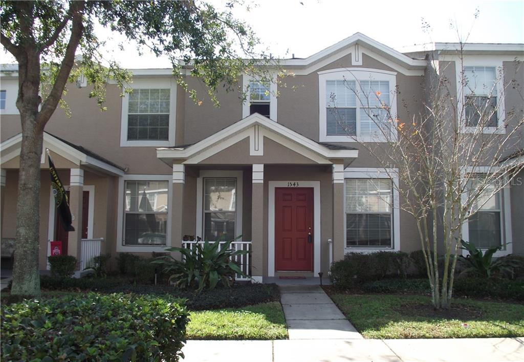 1543 Blue Magnolia Road Brandon, FL 33510 - Photo 1 of 1 Front of the home with a covered porch.
