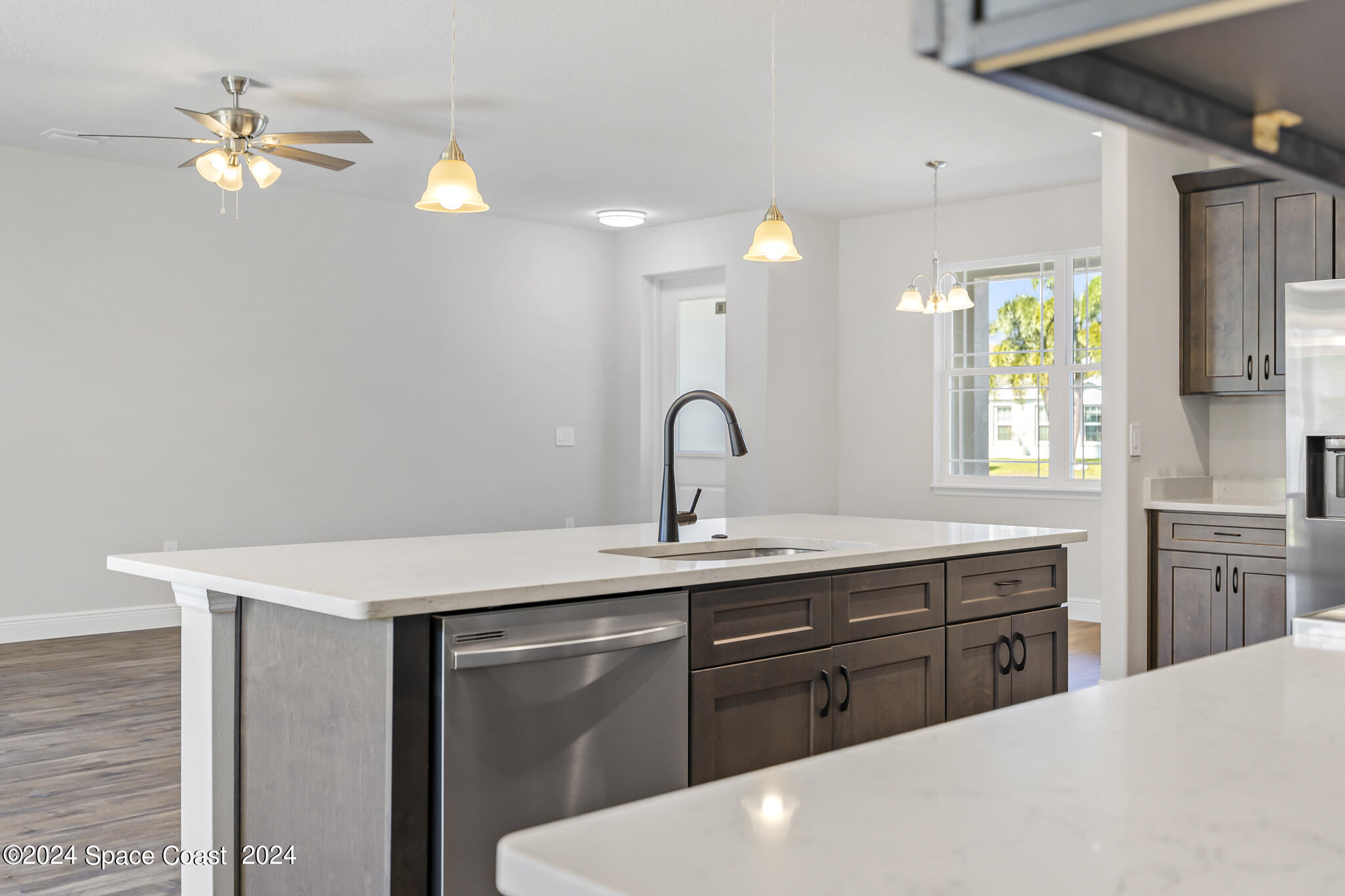 1368 Rabbit Street Southeast Palm Bay, FL 32909 - Photo 9 of 31 a kitchen with a sink cabinets and window