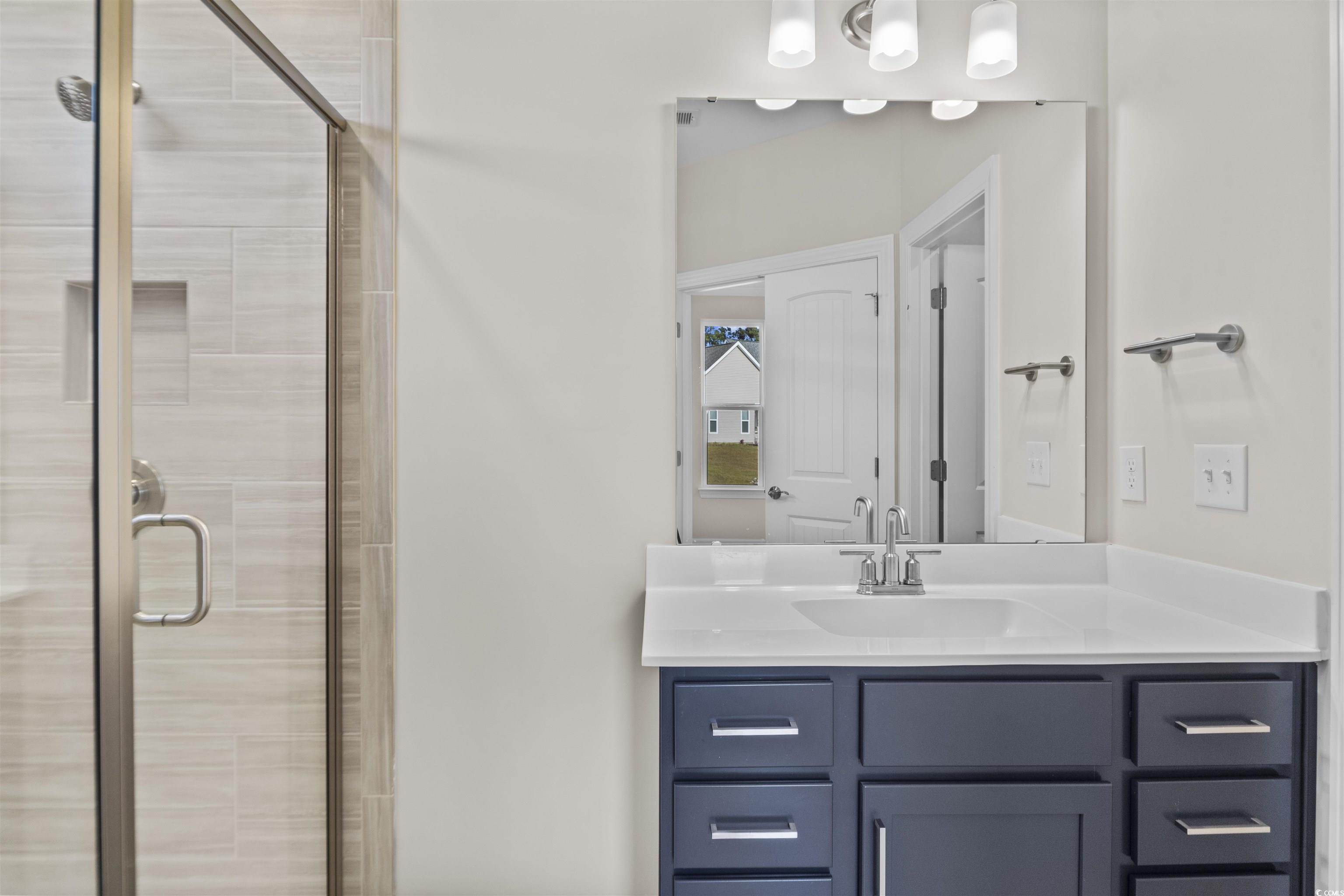 843 Cascade Loop Little River, SC 29566 - Photo 13 of 27 Bathroom with vanity and a shower with door