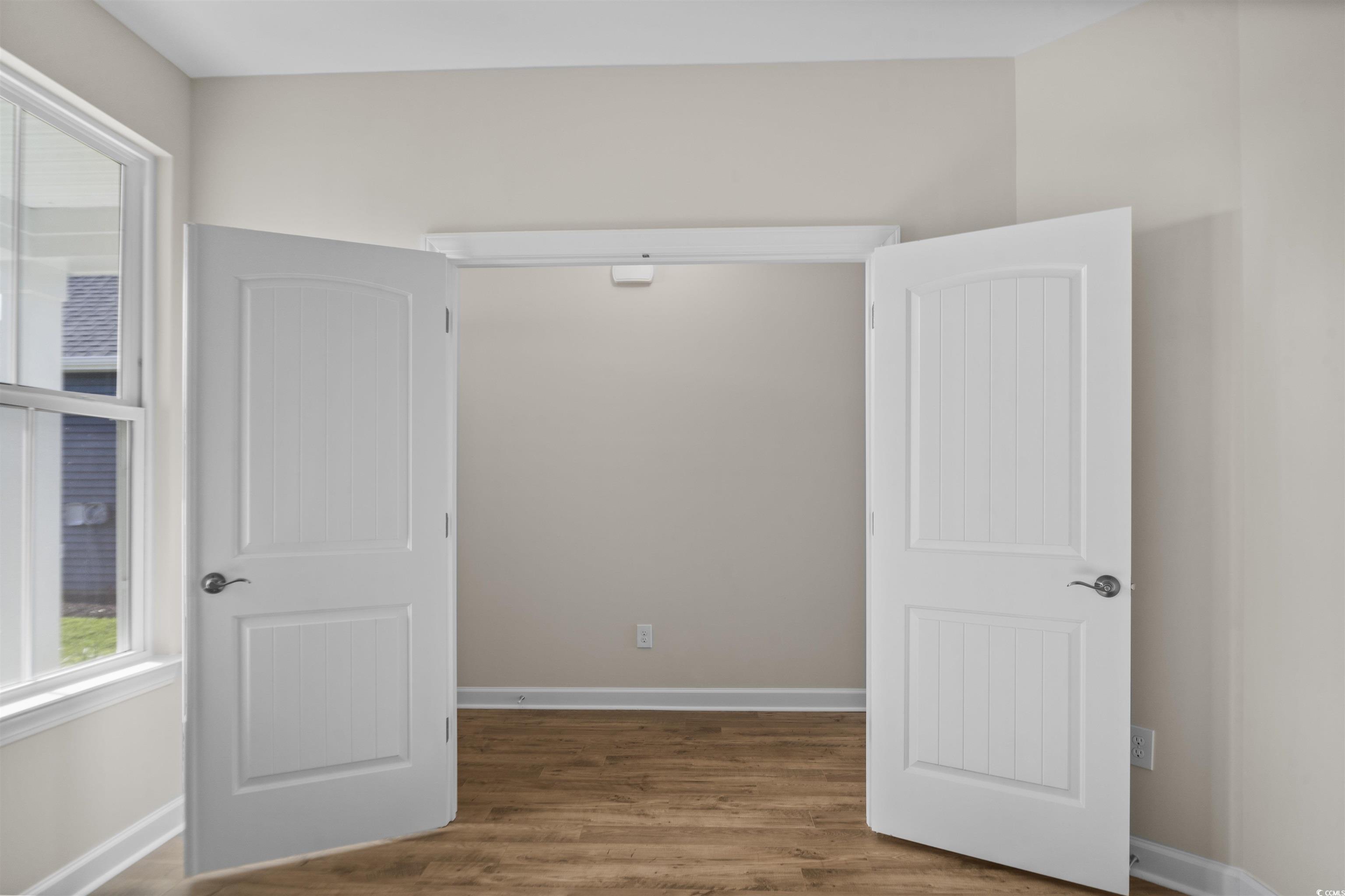 843 Cascade Loop Little River, SC 29566 - Photo 9 of 27 Spare room featuring dark hardwood / wood-style fl