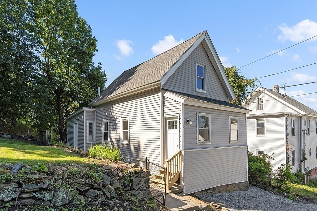 5 Montreal Street Worcester, MA 01604 - Photo 1 of 29 a front view of a house with a yard