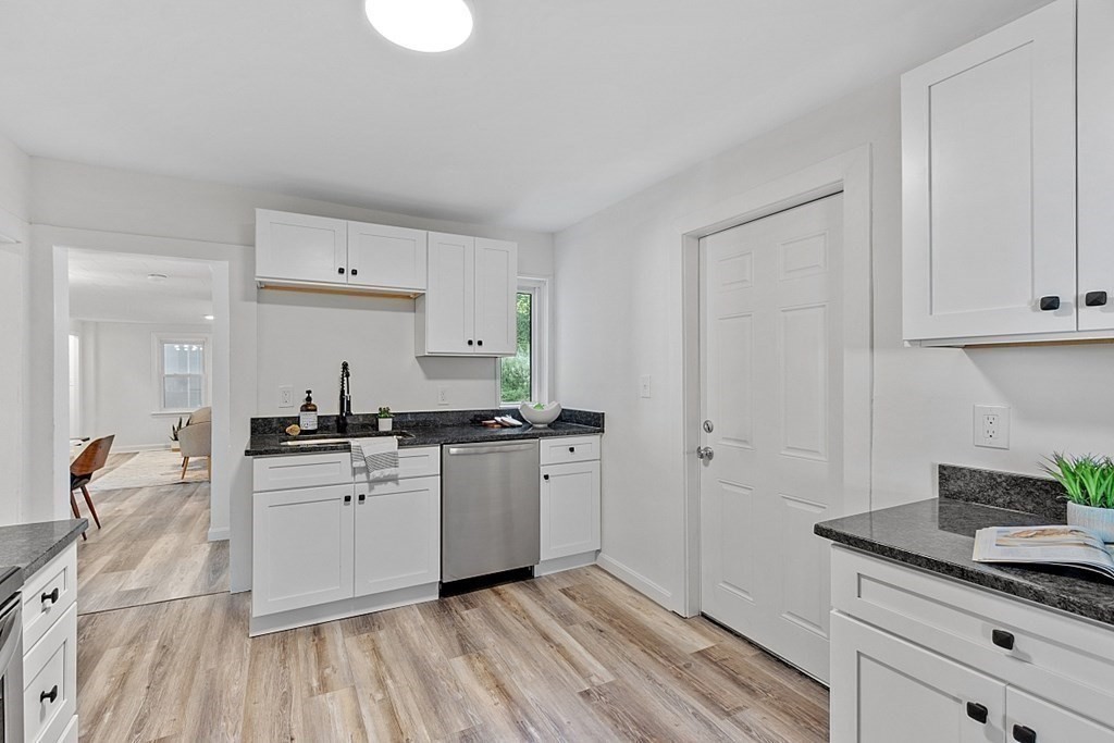 5 Montreal Street Worcester, MA 01604 - Photo 19 of 29 a kitchen with stainless steel appliances granite countertop a sink stove and cabinets