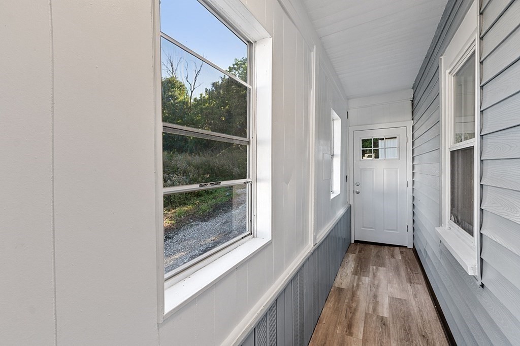 5 Montreal Street Worcester, MA 01604 - Photo 5 of 29 a view of hallway with a large window and wooden floor