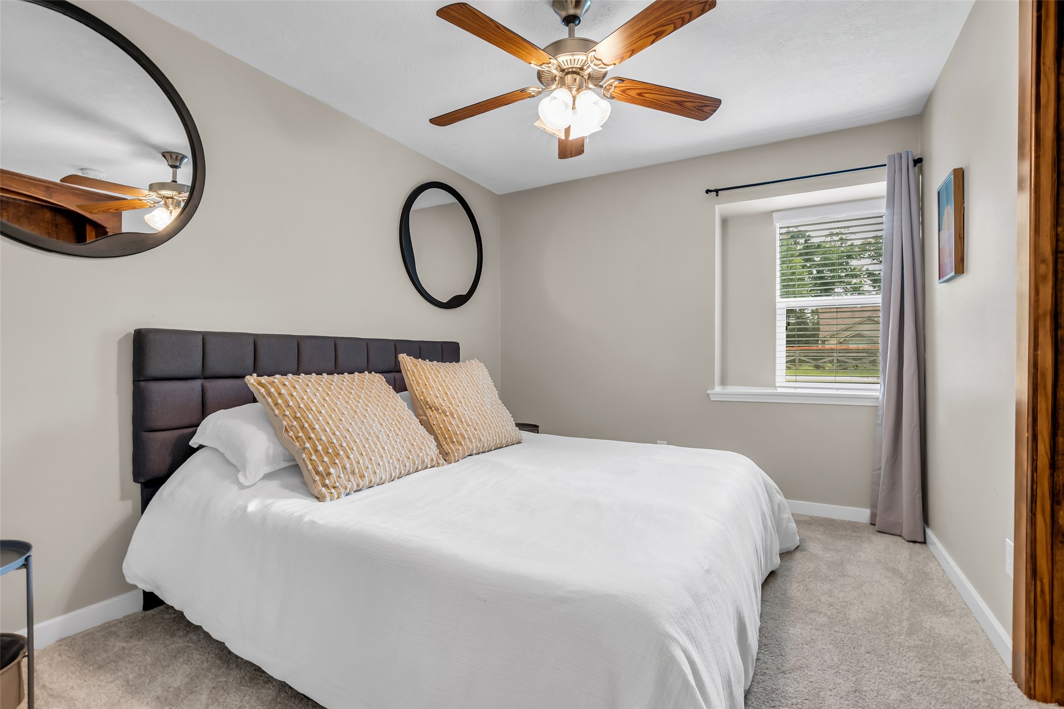22502 Fields Lane Spring, TX 77389 - Photo 21 of 39 This cozy 2nd bedroom with a ceiling fan. A window allows natural light. Neutral tones create a calm, inviting atmosphere.