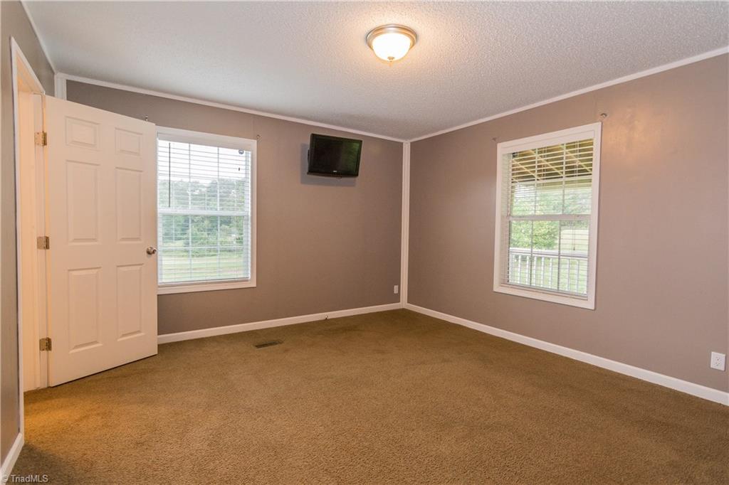 1049 Hickory Fork Road Walnut Cove, NC 27052 - Photo 11 of 24 The master bedroom suite is very large with a walk-in closet.