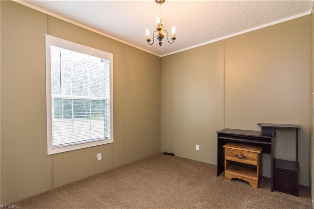 1049 Hickory Fork Road Walnut Cove, NC 27052 - Photo 18 of 24 Bedroom 3 also with netural colors and closet.