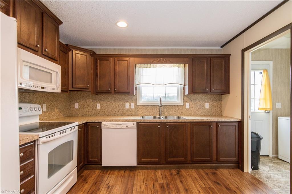 1049 Hickory Fork Road Walnut Cove, NC 27052 - Photo 8 of 24 The kitchen has a beautiful view overlooking the backyard and fields beyond.