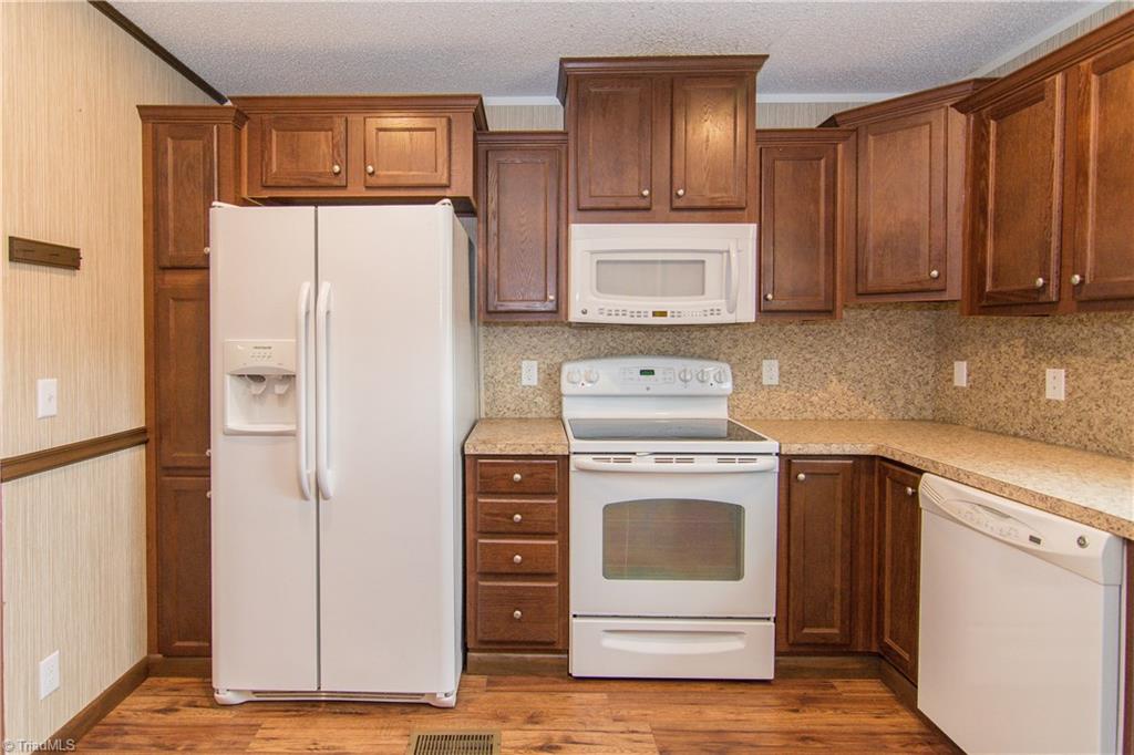 1049 Hickory Fork Road Walnut Cove, NC 27052 - Photo 9 of 24 The kitchen also has chair rail.