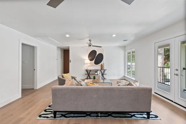 a view of a hallway with chandelier