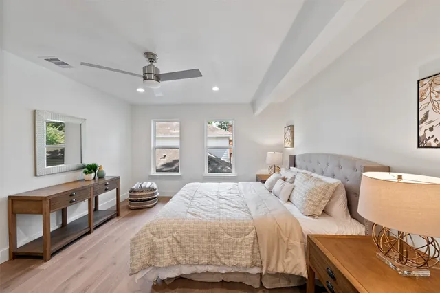 a bathroom with a bathtub sink and mirror