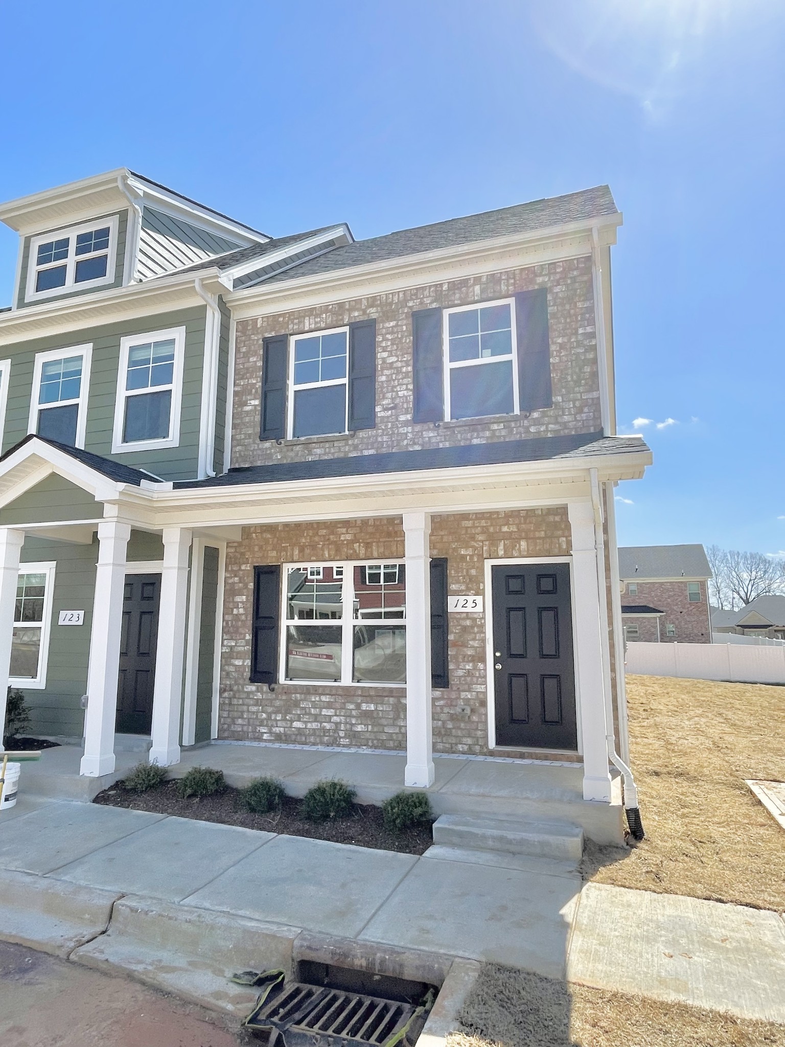 125 Addi Street Pleasant View, TN 37146 - Photo 1 of 14 a front view of a house with a yard