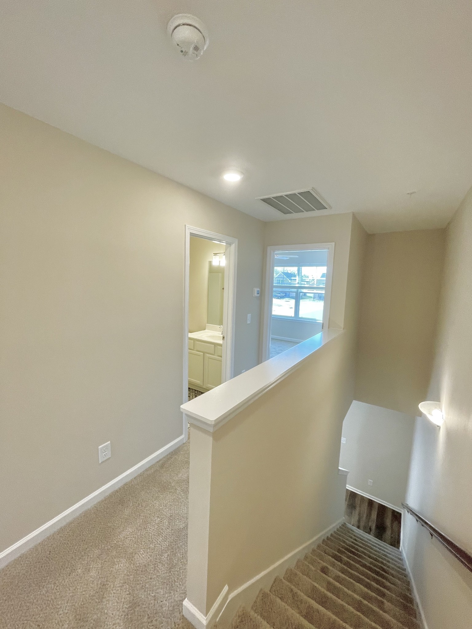 125 Addi Street Pleasant View, TN 37146 - Photo 8 of 14 a view of a hallway with wooden floor and staircase
