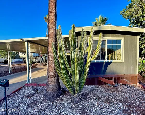 a view of a house with backyard and porch