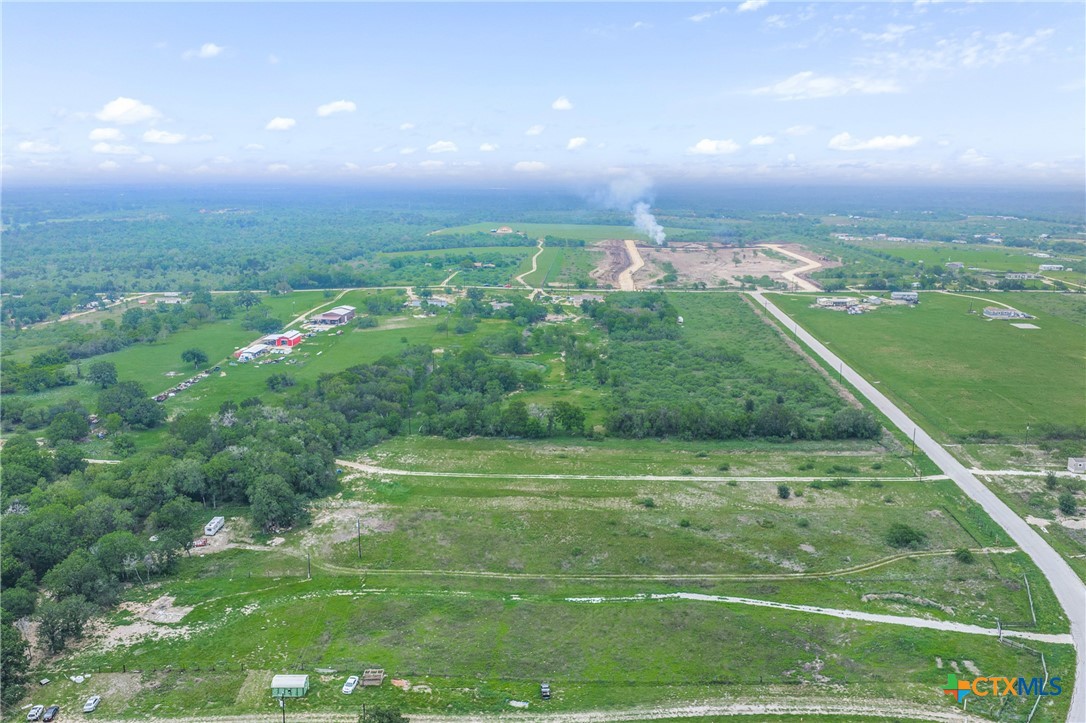 6497 Taylorsville Road Dale, TX 78616 - Photo 25 of 36 a view of a golf course with a lake