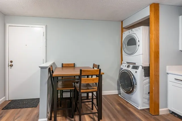 a view of a dining room with furniture and a window