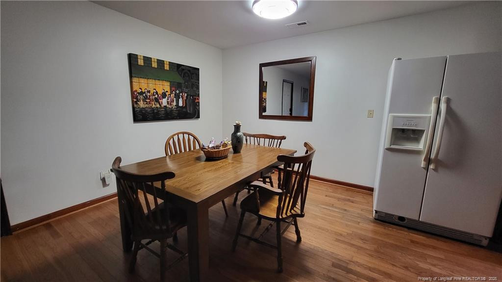1790 Rozier Church Road Lumberton, NC 28360 - Photo 3 of 12 a dining room with furniture and wooden floor