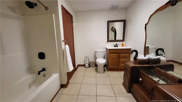a bathroom with a bathtub and a sink