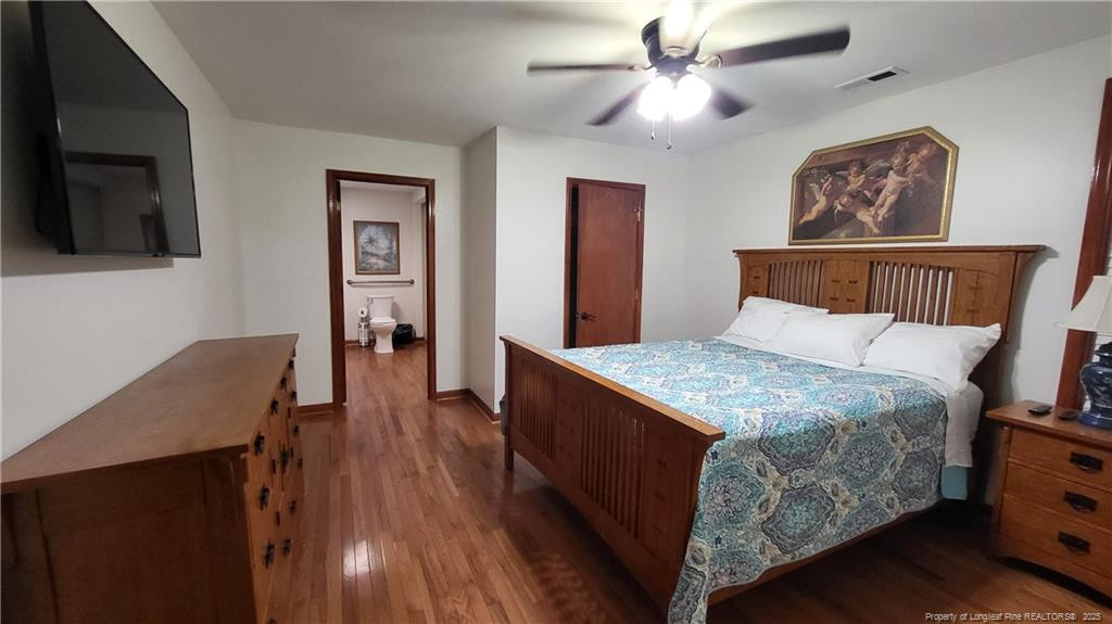 1790 Rozier Church Road Lumberton, NC 28360 - Photo 9 of 12 a bed room with a bed and a television