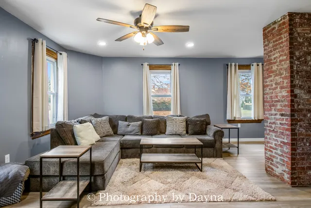 a living room with furniture and a window