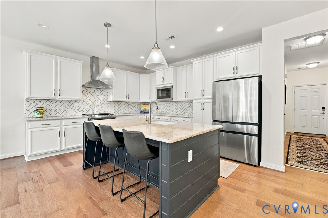 12824 Deep Wl Road Midlothian, VA 23112 - Photo 5 of 42 Gourmet kitchen featuring a central island with ba